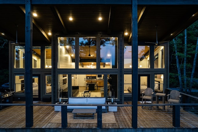 view of back of house at night