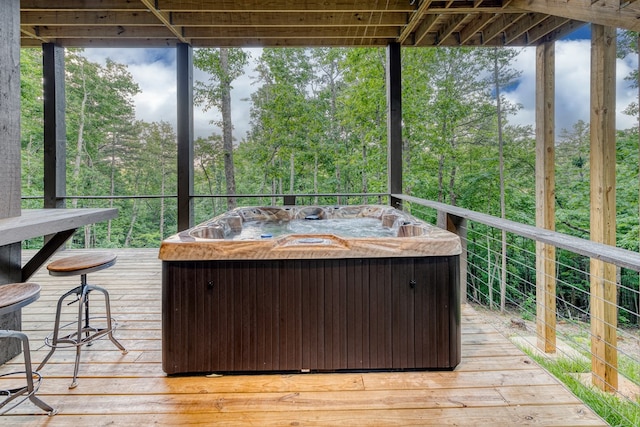 wooden terrace with a hot tub