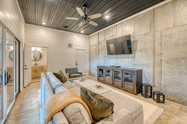 living room with ceiling fan, visible vents, wooden ceiling, concrete floors, and recessed lighting