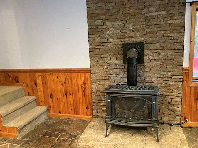 room details with a wood stove and wooden walls