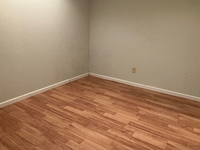 spare room with light hardwood / wood-style floors