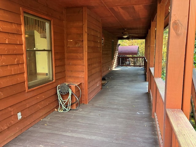 deck featuring ceiling fan and a porch