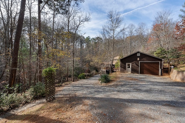 exterior space featuring an outbuilding and a garage