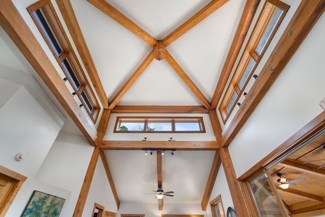 interior details with beamed ceiling and ceiling fan