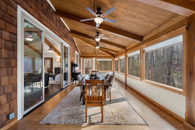 unfurnished sunroom with lofted ceiling with beams and wooden ceiling