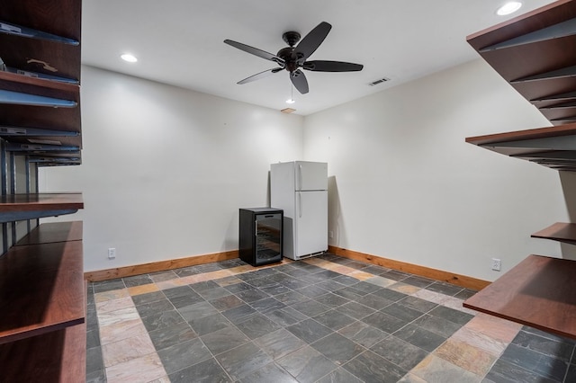 misc room featuring ceiling fan and beverage cooler