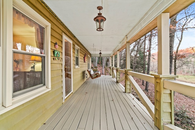 wooden terrace with a porch