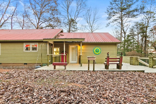 101 Harper Vly, Ellijay, GA 30540 - view of front facade featuring crawl space, metal roof, and a patio