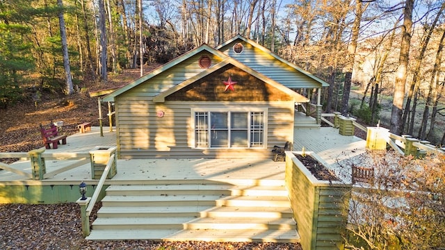 back of house with a wooden deck