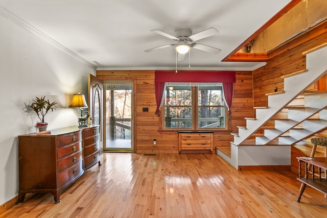101 Harper Vly, Ellijay, GA 30540 - foyer entrance featuring wooden walls, a ceiling fan, light wood-style floors, stairs, and ornamental molding