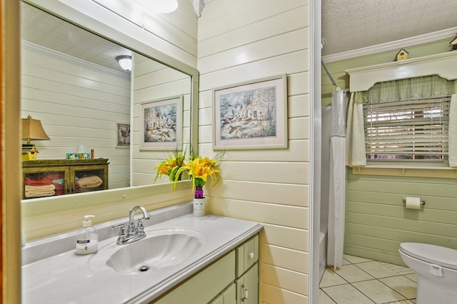 full bathroom featuring tile patterned floors, ornamental molding, a textured ceiling, and wooden walls