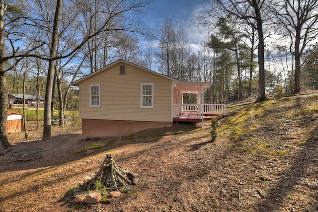 view of home's exterior with a deck