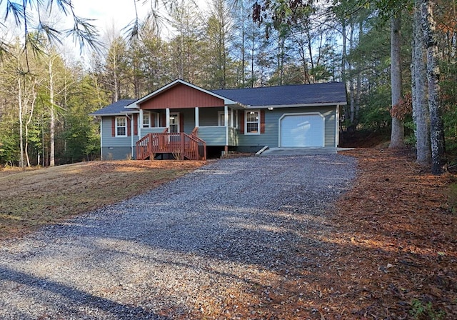 view of front of property featuring a garage and covered porch