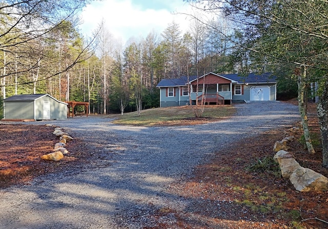 view of front of house featuring a storage unit