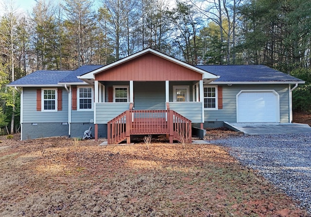 ranch-style home featuring a garage and a porch