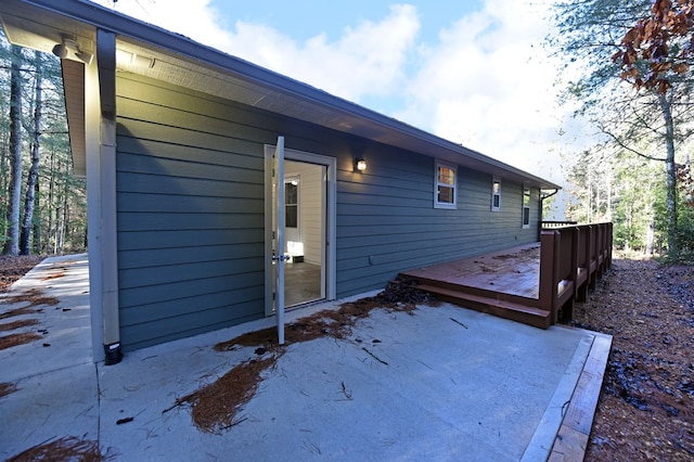 view of property exterior featuring a deck