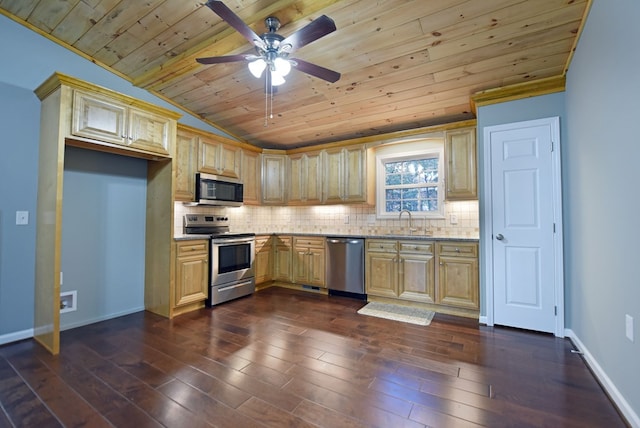 kitchen featuring dark hardwood / wood-style flooring, backsplash, stainless steel appliances, and sink