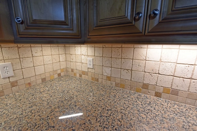 details featuring light stone countertops