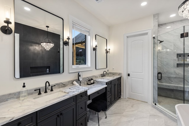 bathroom featuring marble finish floor, a stall shower, recessed lighting, an inviting chandelier, and vanity