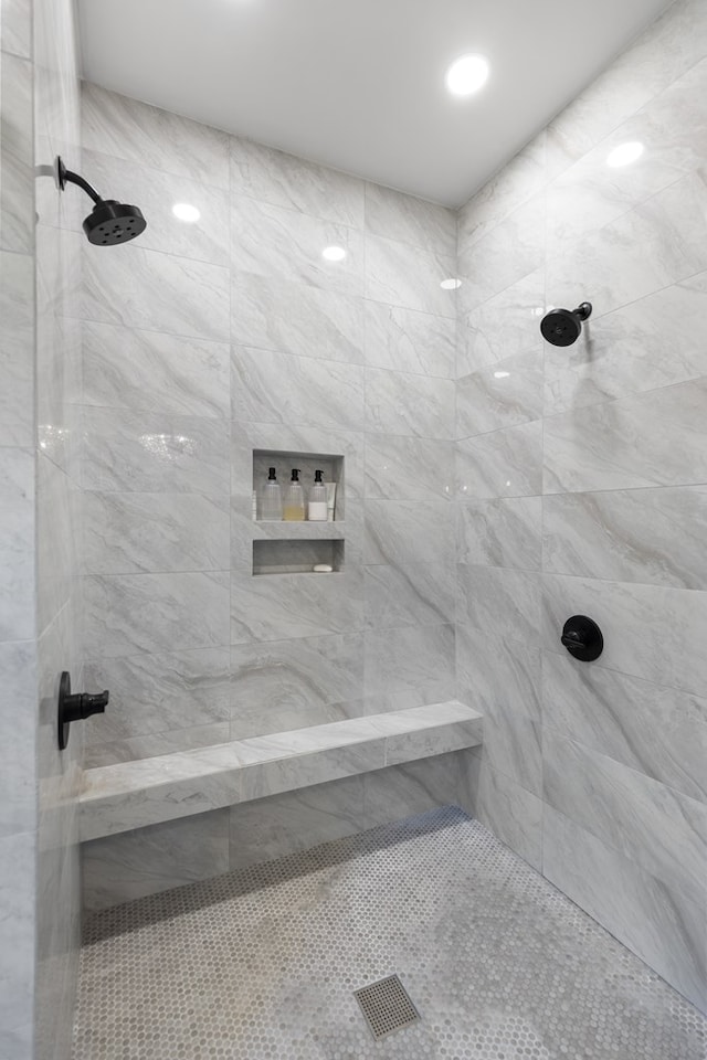 full bath with a tile shower