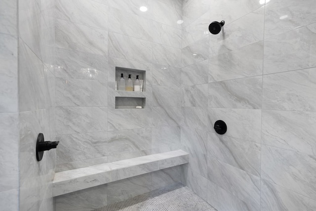 bathroom with tiled shower