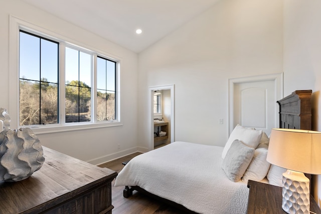 bedroom with dark wood finished floors, recessed lighting, high vaulted ceiling, and baseboards