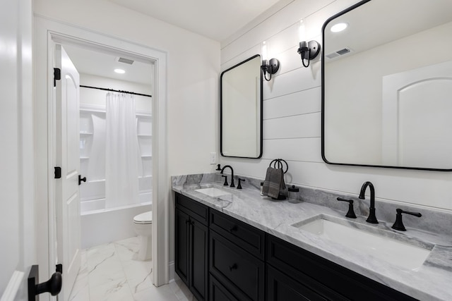 bathroom featuring visible vents, marble finish floor, toilet, and a sink