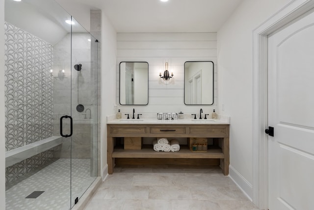 bathroom featuring a sink, double vanity, and a shower stall