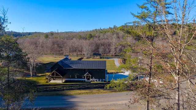 aerial view featuring a wooded view