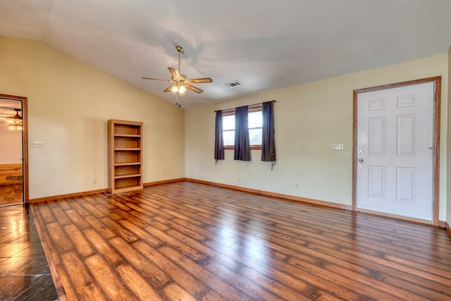 unfurnished room featuring ceiling fan, dark hardwood / wood-style floors, a textured ceiling, and lofted ceiling