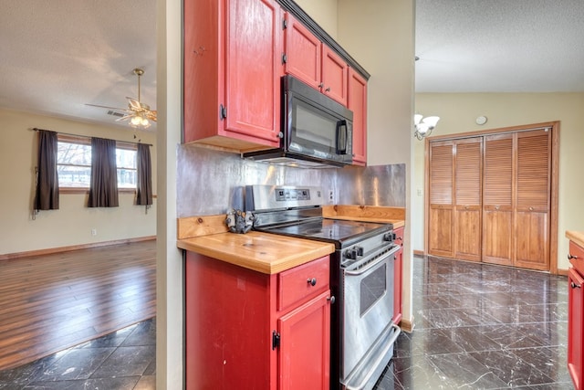 kitchen with lofted ceiling, butcher block counters, a textured ceiling, stainless steel range with electric cooktop, and decorative backsplash