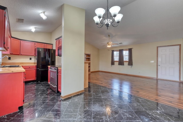 kitchen with wooden counters, black appliances, lofted ceiling, dark hardwood / wood-style flooring, and sink