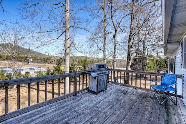 wooden deck featuring grilling area and a mountain view