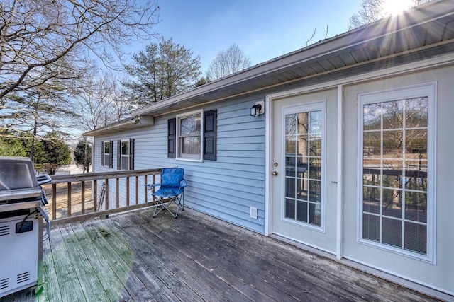 wooden terrace with area for grilling