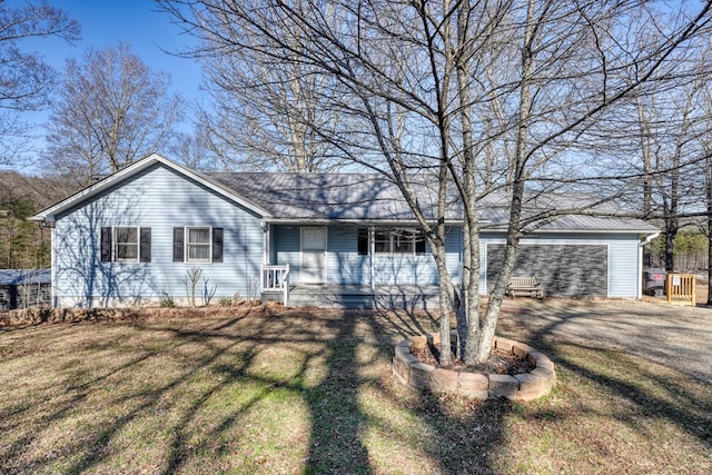 single story home featuring a garage and a front lawn