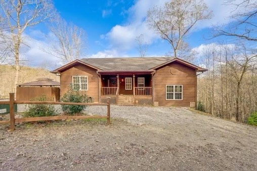 ranch-style house with covered porch