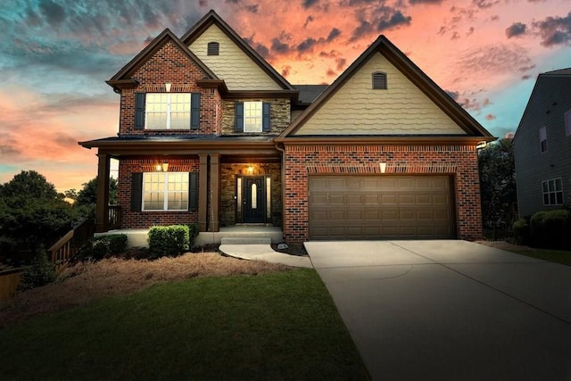 6665 Flagstone Ct, Cumming, GA 30028 - view of front of home featuring brick siding, driveway, a garage, and a front lawn