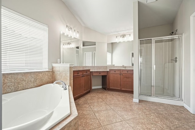 6665 Flagstone Ct, Cumming, GA 30028 - bathroom with vanity, a shower stall, lofted ceiling, a garden tub, and tile patterned flooring