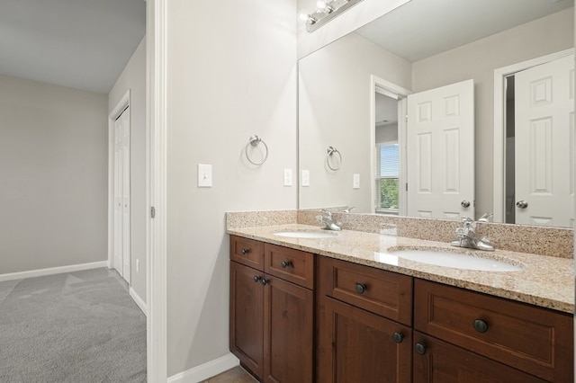 6665 Flagstone Ct, Cumming, GA 30028 - bathroom featuring double vanity and baseboards
