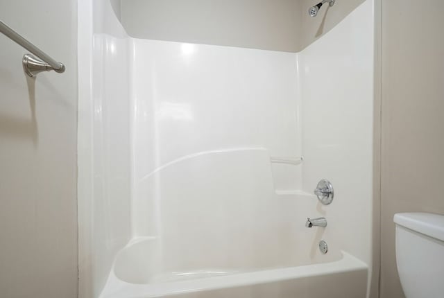 6665 Flagstone Ct, Cumming, GA 30028 - bathroom featuring shower / bathtub combination and toilet