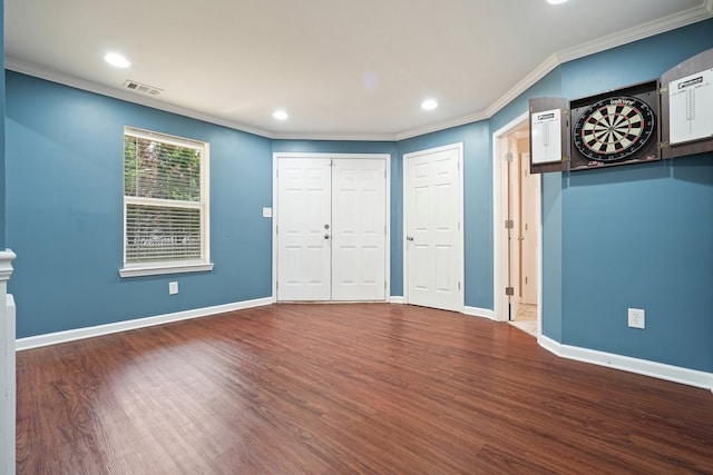 6665 Flagstone Ct, Cumming, GA 30028 - foyer entrance with crown molding, wood finished floors, and recessed lighting