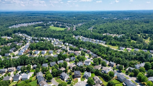 6665 Flagstone Ct, Cumming, GA 30028 - aerial perspective of suburban area featuring a forest
