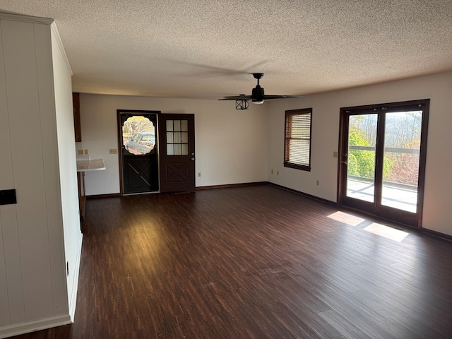 558 Old Dyer Rd, Hayesville, NC 28904 - entrance foyer featuring dark wood-type flooring, a textured ceiling, baseboards, and ceiling fan
