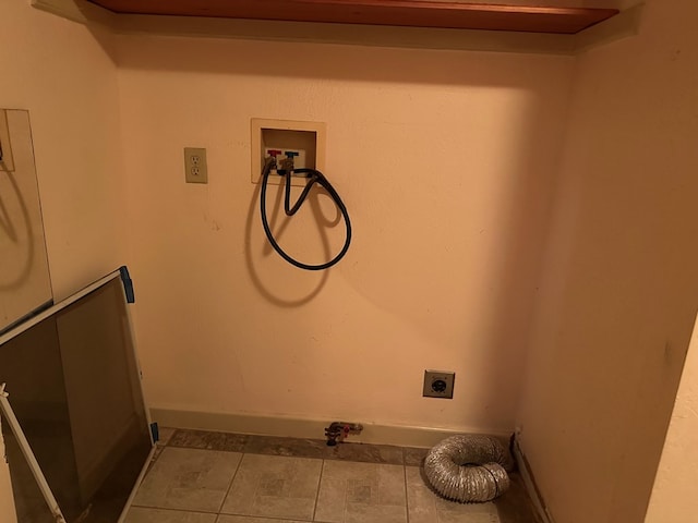 laundry room with tile patterned flooring, washer hookup, and electric dryer hookup