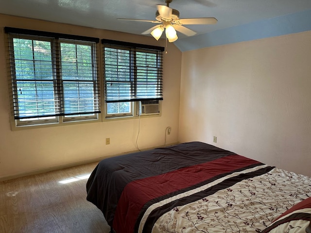 carpeted bedroom featuring cooling unit and ceiling fan