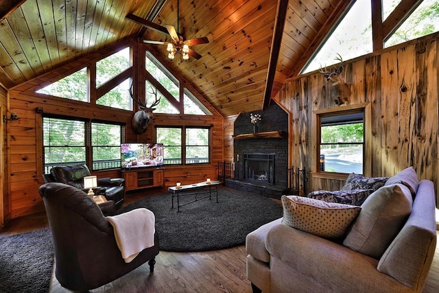 162 Grayson Pt, Blue Ridge, GA 30513 - living area featuring wooden ceiling with exposed beams, wood finished floors, wooden walls, high vaulted ceiling, and a stone fireplace