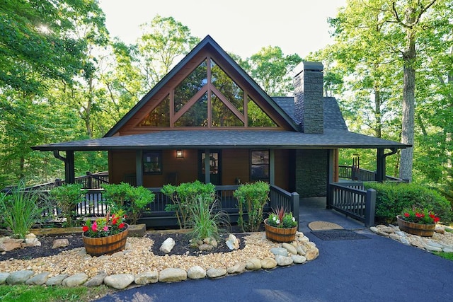 162 Grayson Pt, Blue Ridge, GA 30513 - view of front of home with a chimney, covered porch, and roof with shingles
