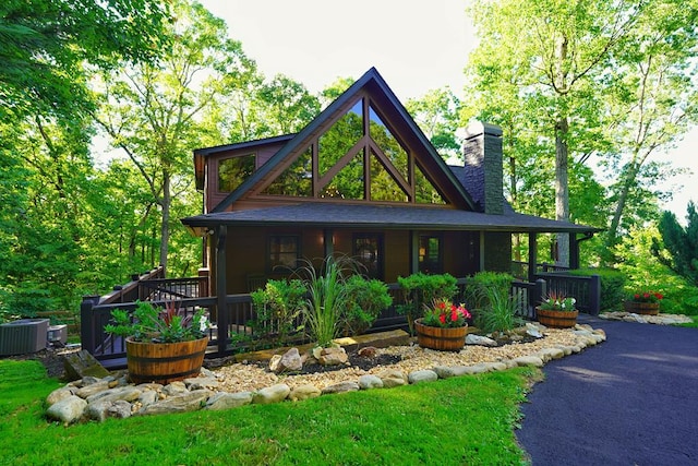 162 Grayson Pt, Blue Ridge, GA 30513 - view of front facade with a chimney, central AC unit, and a porch