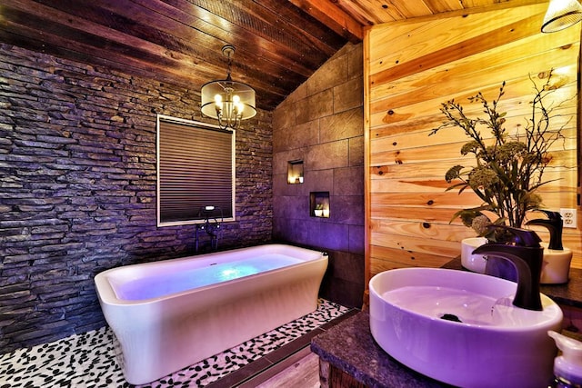 162 Grayson Pt, Blue Ridge, GA 30513 - bathroom with lofted ceiling, a freestanding bath, wooden ceiling, a chandelier, and wood finished floors