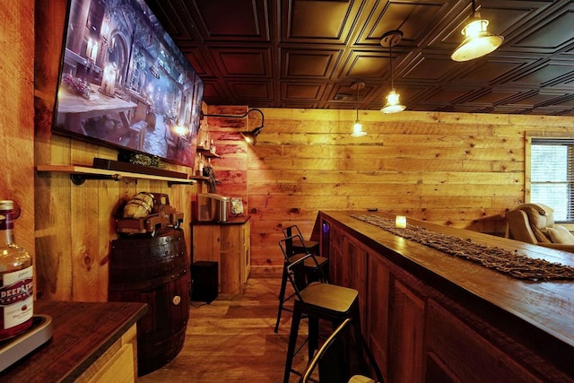 162 Grayson Pt, Blue Ridge, GA 30513 - bar area featuring an ornate ceiling, wooden walls, and wood finished floors